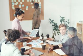 Board room full of people at a table